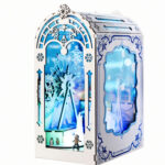 Book Nook Kit The Great Ice World with white arched cabinet, blue snowflakes and illuminated winter scene on white