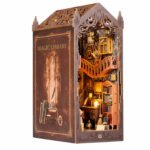 Magic Library Fantasy Book Nook Kit with Gothic cutwork, illuminated shelves, curved balcony, books, desk, and warm lighting