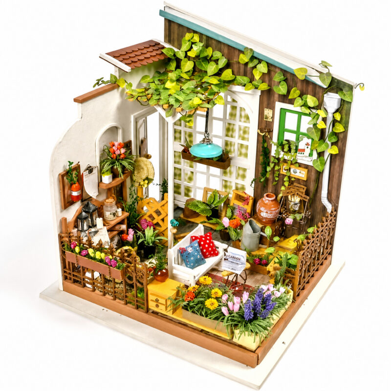 Book Nook Kit Miller's Garden miniature with vines, flowers, seating and gardening accessories on white