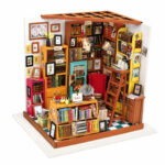 Book Nook Kit Sam's Study miniature library with bookshelves, red chair, ladder and reading desk on white
