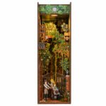 Secret Garden DIY Book Nook Kit for Miniature Scenes with flowering trees, garden gate, figures, and warm light