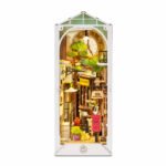 DIY Sunshine Town Book Nook Kit street scene with LED lights, clock, bookshop, trees, flowers, and red mailbox